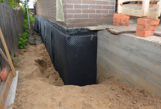 SJ Waterproofing Pros technician performing targeted Basement Waterproofing assessment in Sparta, MI